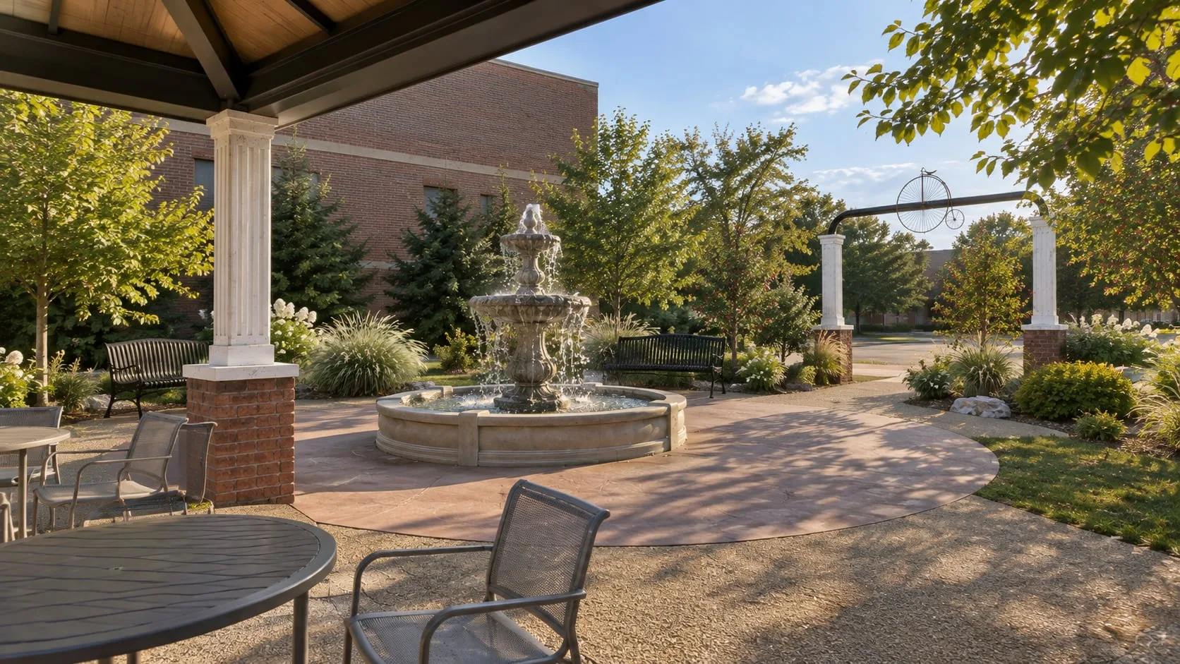 The court seen from under the pavilion roof, fountain and seating