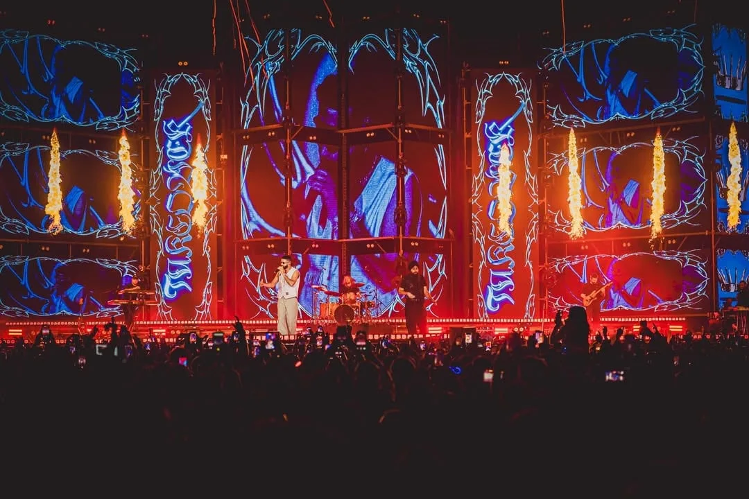 LED bays carrying ornate blue and orange patterning, flame accents between them